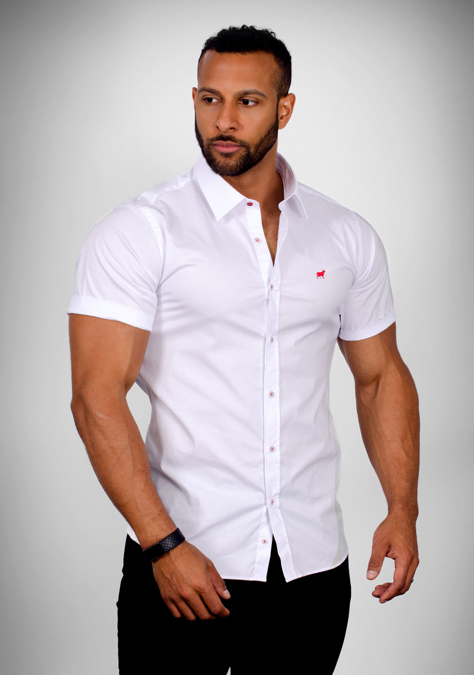 White short sleeve muscle fit shirt on an athletically built model, showcasing the athletic fit design that enhances physique, with stretch fabric for comfort and mobility