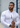 White linen athletic fit shirt on an athletically built model, showcasing the muscle fit design that enhances physique, with stretch fabric for comfort and mobility