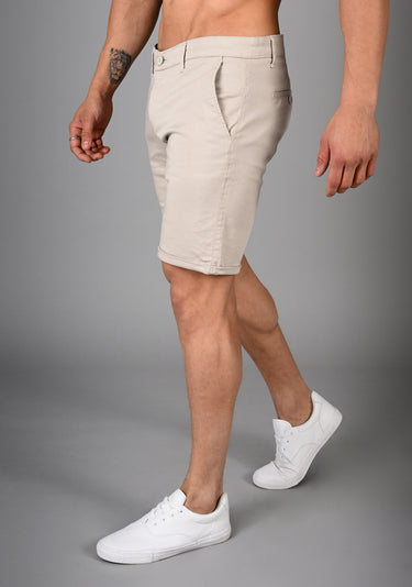 Comfortable beige muscle fit shorts with an adaptive muscle fit design for enhanced movement and durability, ideal for exercise and casual wear.