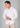 White linen muscle fit shirt on an athletically built model, showcasing the athletic fit design that enhances physique, with stretch fabric for comfort and mobility