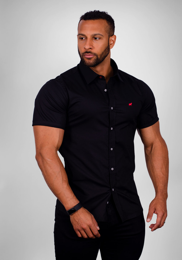 Black short sleeve muscle fit shirt on an athletically built model, showcasing the athletic fit design that enhances physique, with stretch fabric for comfort and mobility