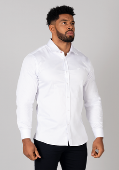 White muscle fit shirt on an athletically built model, showcasing the athletic fit design that enhances physique, with stretch fabric for comfort and mobility
