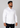 White muscle fit shirt on an athletically built model, showcasing the athletic fit design that enhances physique, with stretch fabric for comfort and mobility