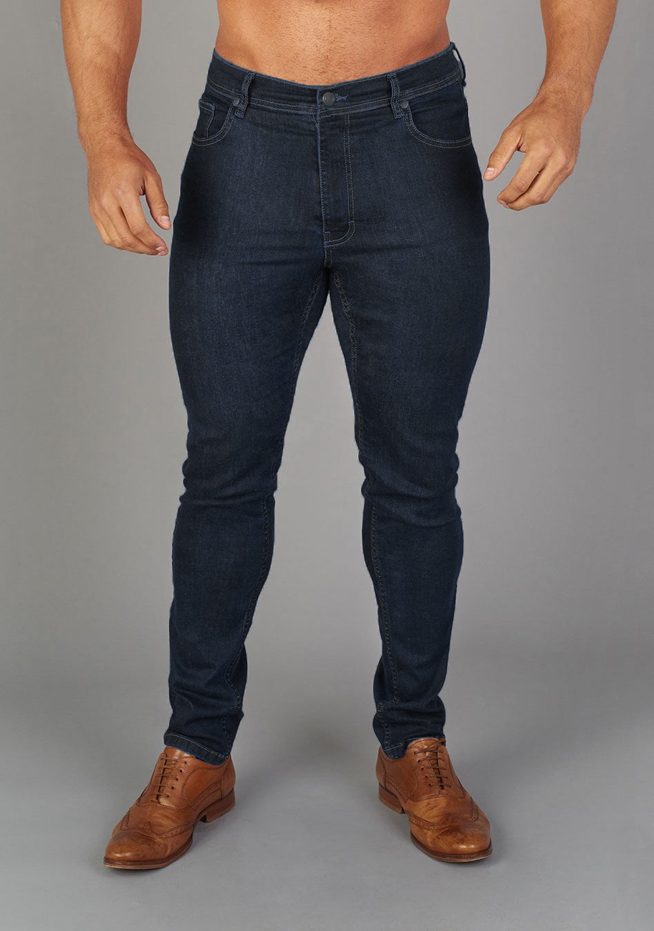 Navy Athletic Fit Jeans by Oxcloth, tailored for muscular physiques, offering comfort and flexibility. Perfect combination of style and function for those seeking muscle fit jeans.