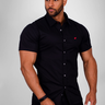 Black short sleeve muscle fit shirt on an athletically built model, showcasing the athletic fit design that enhances physique, with stretch fabric for comfort and mobility