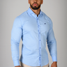 Light Blue muscle fit shirt on an athletically built model, showcasing the athletic fit design that enhances physique, with stretch fabric for comfort and mobility