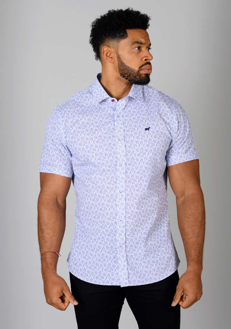 Floral short sleeve muscle fit shirt on an athletically built model, showcasing the athletic fit design that enhances physique, with stretch fabric for comfort and mobility