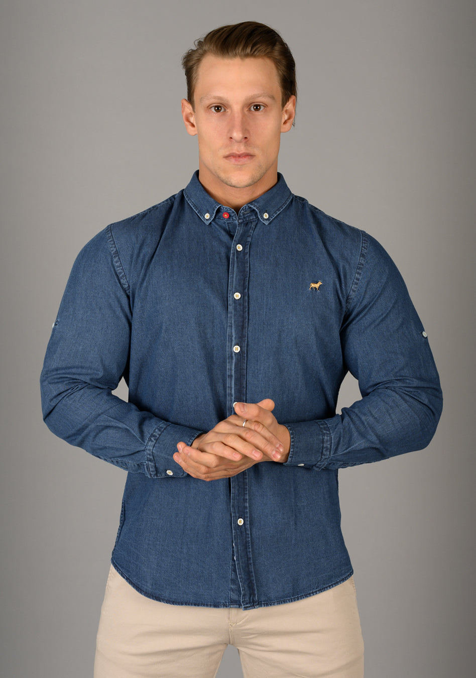 Blue Denim athletic fit shirt on an athletically built model, showcasing the muscle fit design that enhances physique, with stretch fabric for comfort and mobility