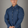 Blue Denim muscle fit shirt on an athletically built model, showcasing the athletic fit design that enhances physique, with stretch fabric for comfort and mobility