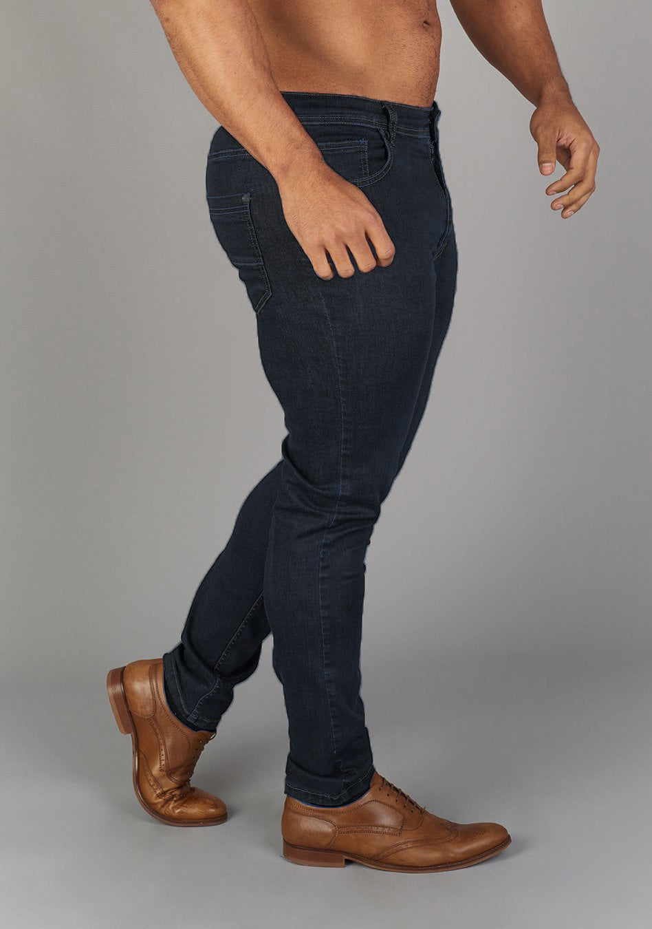 Navy muscle Fit Jeans by Oxcloth, tailored for muscular physiques, offering comfort and flexibility. Perfect combination of style and function for those seeking athletic fit jeans.
