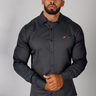 Grey muscle fit shirt on an athletically built model, showcasing the athletic fit design that enhances physique, with stretch fabric for comfort and mobility