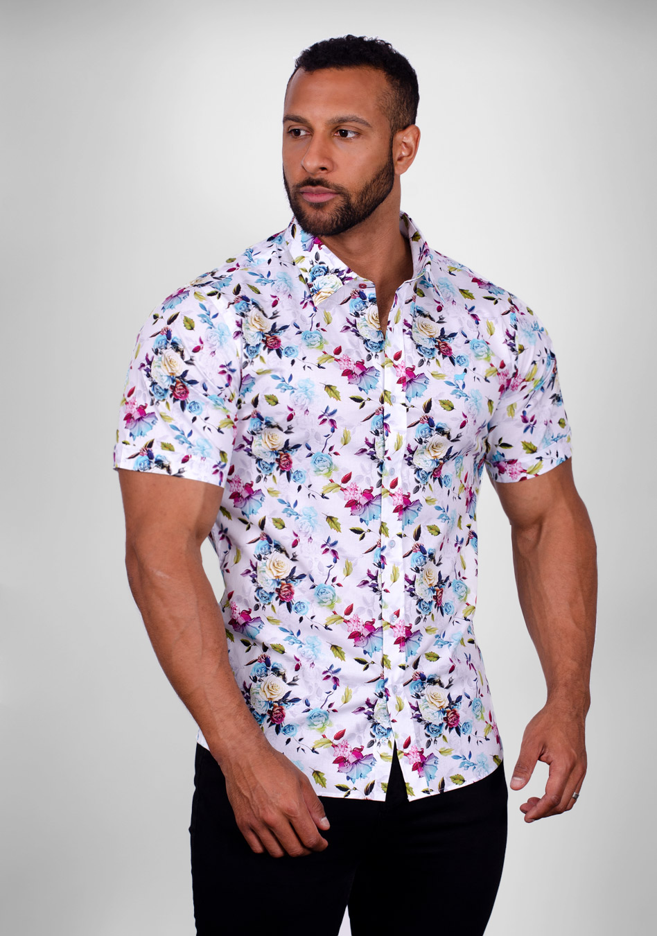 White Floral short sleeve muscle fit shirt on an athletically built model, showcasing the athletic fit design that enhances physique, with stretch fabric for comfort and mobility