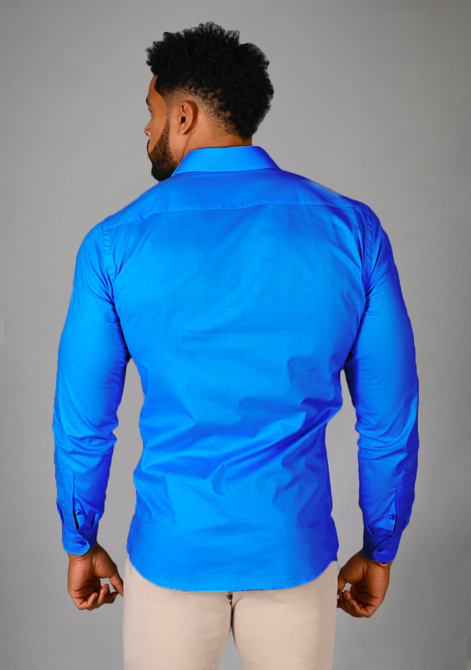 Electric Blue athletic fit shirt on an athletically built model, showcasing the muscle fit design that enhances physique, with stretch fabric for comfort and mobility