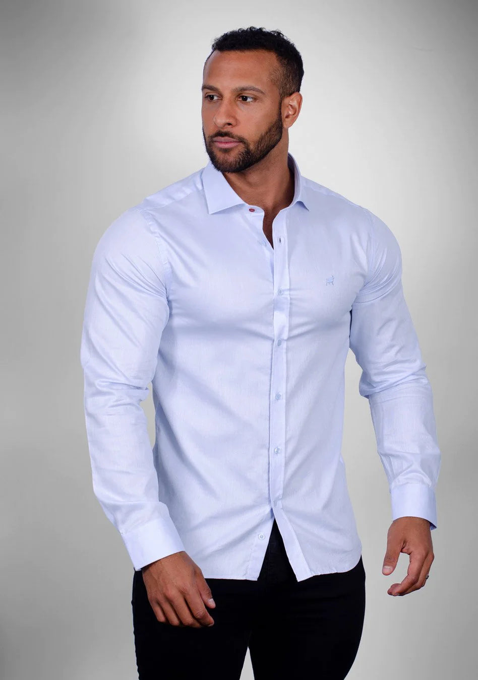 Sky Blue muscle fit shirt on an athletically built model, showcasing the athletic fit design that enhances physique, with stretch fabric for comfort and mobility